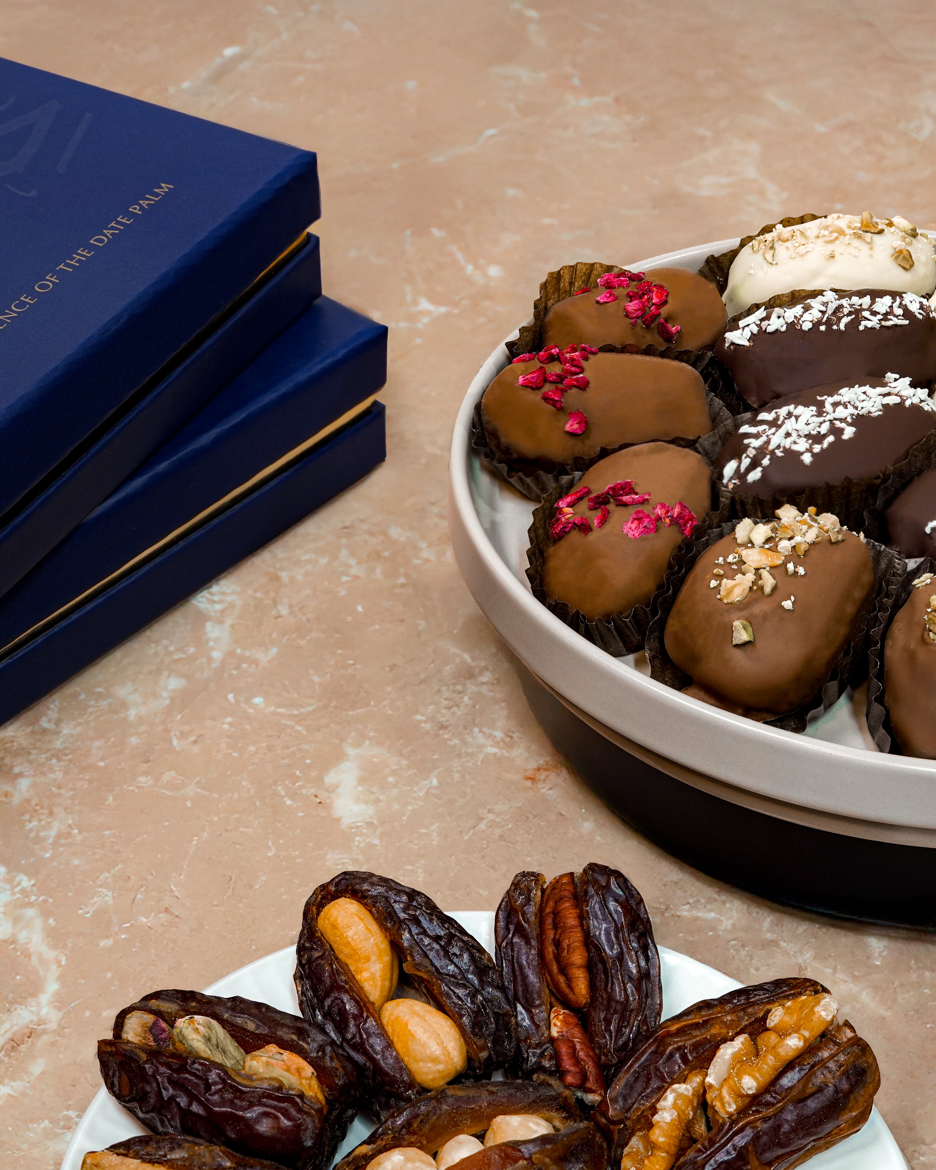 Assorted luxury filled dates with nuts and chocolate in a Wahy gift box